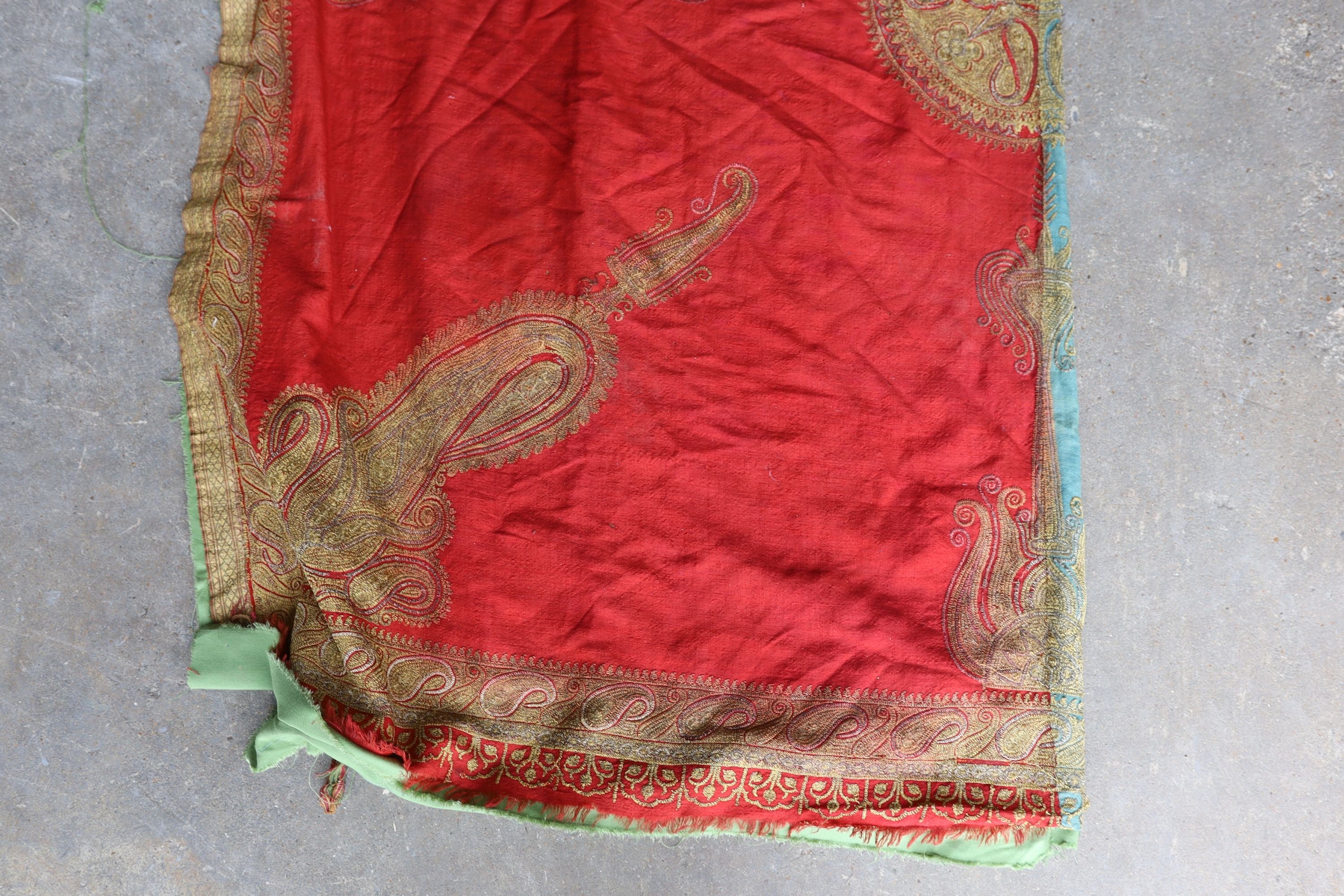 A silkwork shawl (a.f.) 270 x 140cm and an Indian embroidered cloth, 185 x180cm